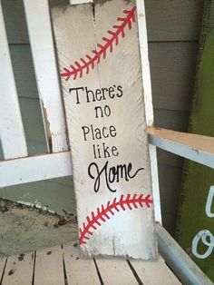 there's no place like home sign with baseballs on the front and back