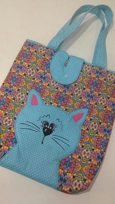 a blue bag with a cat on it