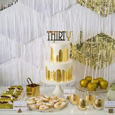 an image of a cake with gold decorations on it