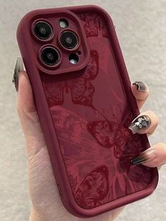 a woman's hand holding an iphone case with red flowers on the front and sides