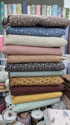 many different fabrics are stacked on top of each other