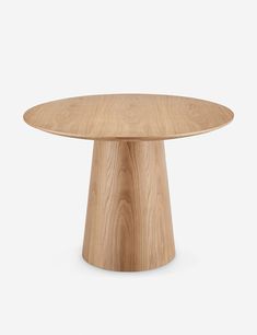 a round wooden table on a white background with the top half turned to look like it is