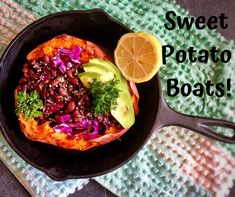 sweet potato boats in a cast iron skillet with avocado and cilantro