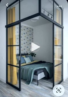 a bedroom with glass walls and yellow curtains