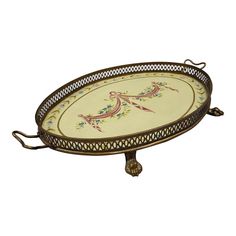 an ornately decorated serving tray with handles