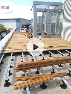 the video shows how to install an outdoor deck with metal rails and wood planks