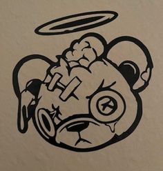 a drawing of a teddy bear with an angel above it's head and eyes