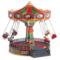 an old fashioned merry go round ride with people riding on the top and below it