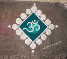 a painting on the side of a building with an om shanti symbol painted on it