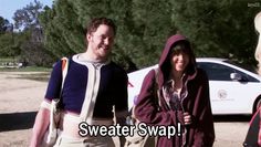 a man and woman are walking together in the sand with text that reads sweater swap