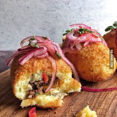 some food is laying on a cutting board and ready to be eaten by someone else