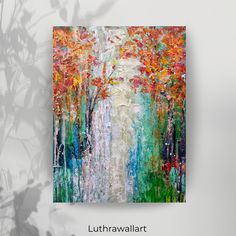 an abstract painting of trees and leaves on a white wall with the words luthrawallart