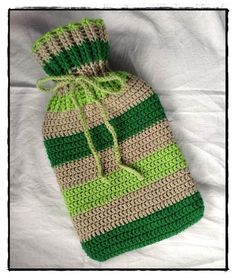 a crocheted green and beige striped bag