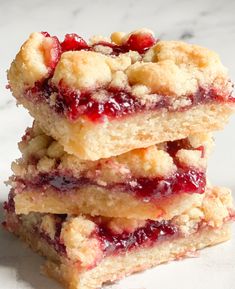 three pieces of cranberry cobble stacked on top of each other in front of a marble countertop