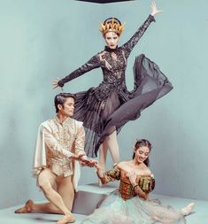 two ballerinas and a dancer posing for a photo