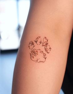 a woman's arm with a tattoo on it that has flowers in the center