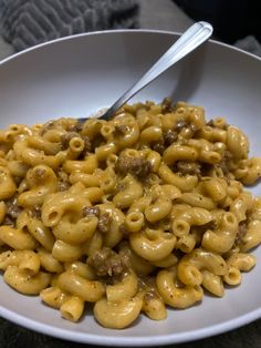 a white bowl filled with macaroni and cheese