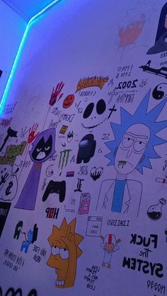 the wall has many stickers on it and is lit up with blue light from below