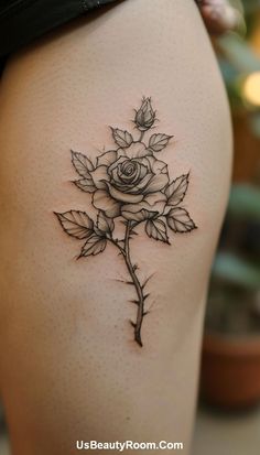 A minimalist black ink hip tattoo of a rose, featuring clean lines and subtle shading, creating a simple yet elegant design. Small Hip Tattoo Ideas, Small Hip Tattoo, Unique Black Women, Heart Lock Tattoo, Hip Tattoos For Girls, Hip Tattoo Ideas, Meaningful Flowers, Lock Tattoo, Bloom Tattoo