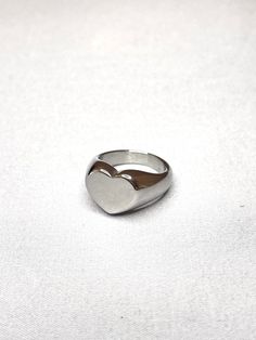 Heart ring made of stainless steel. No green fingers. Water safe. Tarnish free. Check out our work on Instagram: @eterno.studios Website: www.eternostudios.com Trendy Silver Heart Ring For Anniversary, Trendy Silver Heart Promise Ring, Silver Trendy Heart Promise Ring, Silver Stainless Steel Signet Ring For Promise, Metal Rings For Anniversary On Valentine's Day, Trendy Silver Heart Rings, Heart-shaped Metal Promise Ring, Silver Stainless Steel Signet Promise Ring, Trendy Silver Heart Ring For Valentine's Day