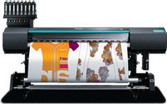 an image of a large plot printer with many colors on the screen and in front of it