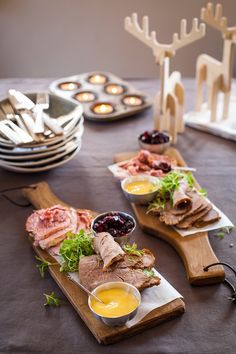 a table topped with plates and bowls filled with food