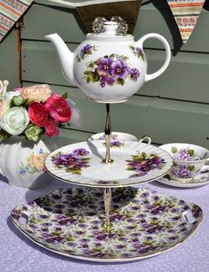 there is a tea set with flowers on it