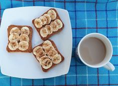 three pieces of toast with banana slices and cinnamon on top next to a cup of coffee