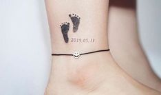 a small foot tattoo on the ankle