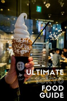 a person holding an ice cream cone in their hand with the words ultimate tokyo food guide