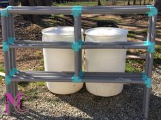 two white plastic barrels sitting next to each other