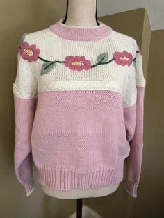 This is such a pretty vintage sweater and it’s in pretty good condition. No holes or stains that I can see. Tag says L….I’d say a solid medium to maybe large for today. I’m a smoke free home. Vintage Cotton Knitted Sweater, Vintage Knitted Cotton Sweater, Vintage Cream Sweater For Spring, Vintage Beige Hand Knitted Sweater, Vintage Hand-knitted Beige Sweater, Vintage Hand Knitted Beige Sweater, Vintage Cream Knit Sweater, Vintage Hand Knitted Crew Neck Sweater, Vintage Hand-knitted Sweater