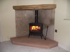 a wood burning stove sitting inside of a living room