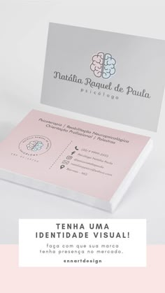 the business card is designed to look like it has been folded in pink and white