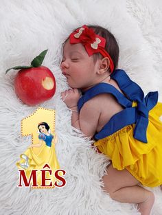 a baby sleeping next to an apple on a white blanket with the words mes