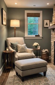 a living room with a chair and footstool in front of a fire place