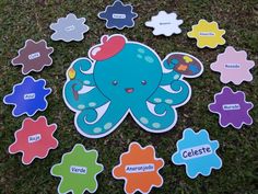 an octopus themed sticker is on the ground with other magnets in front of it