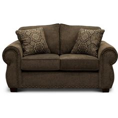 a brown couch with two pillows on it