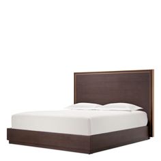 a bed with white sheets and brown headboard