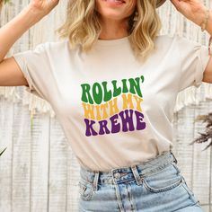 It's time to get ready for Mardi Gras! Style your way through Mardi Gras season with our Rollin' With My Krewe Mardi Gras Graphic Tee! Our tees are sublimated on super soft unisex t-shirts. Pair perfectly with a cardigan or jacket and your favorite pair of jeans or leggings! SIZING:This is a true to size unisex shirt. Our customers are most satisfied with the size they normally wear in a women's size t-shirt.Small fits sizes 4-6Medium fits sizes 8-10Large fits sizes 12-14XLarge fits sizes 16-182 Mardi Gras Jean Jacket, Mardi Gras Shirt, Heather White, Peach Pink, Unisex Shirt, Mardi Gras, Soft Fabrics, Shirts Tops, Loose Fitting