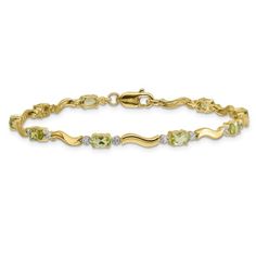 14k yellow gold and rhodium over 14k yellow gold fancy diamond and 2.250 cttw peridot bracelet. Measures approximately 1/8 of an inch in width and has a lobster claw closure. Yellow Gold Cubic Zirconia Jewelry With Accent Stones, Gold Multi-stone Diamond Bracelet, Anniversary Peridot Jewelry With Diamond Accents, Yellow Gold Gemstone Bracelet In Fine Jewelry Style, Yellow Gold Peridot Gemstone Jewelry, Elegant Multi-stone Yellow Gold Diamond Bracelet, Gold Peridot Jewelry With Gemstone, Fine Jewelry With Peridot And Accent Stones, Gold Peridot Gemstone Jewelry