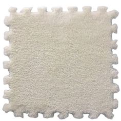 a white rug that has been placed on top of the floor for use as a mat