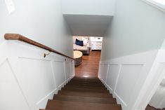 an overhead view of a staircase leading to a bedroom