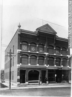 an old black and white photo of a building