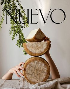 a woman holding two baskets over her face with the words nevevo on it