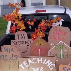 a truck with signs on the back of it that read ym presidents and teachers