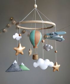 a mobile that is made to look like a hot air balloon with stars and clouds