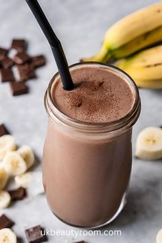 a smoothie with chocolate and bananas on the side