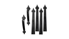 an assortment of black iron door handles