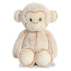 a small stuffed monkey sitting up against a white background